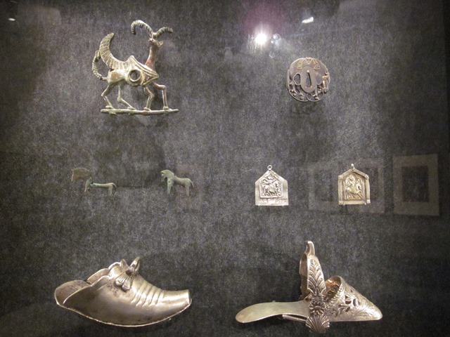 Objects ranging froan Iranian cheekpiece c. 700 BCE (top left) to 20th century Mexican stirrups (below, left and right)